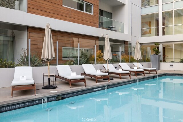 community pool featuring a patio area