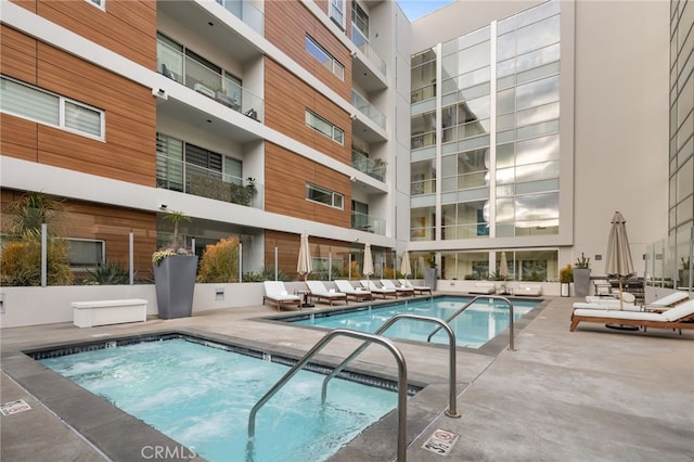 community pool with a patio