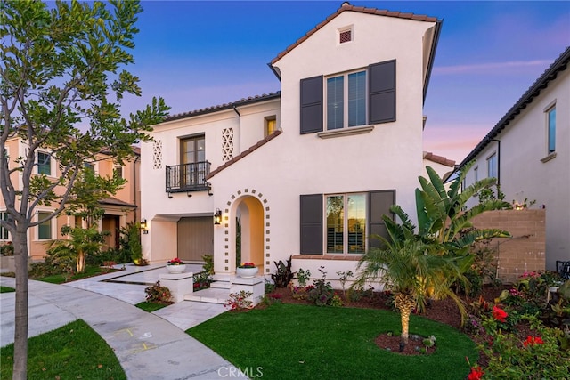 244 Coal Mine, Irvine, CA 92602 - mediterranean / spanish house with a balcony, stucco siding, a front lawn, and a tiled roof