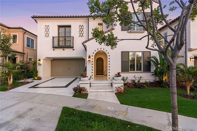 244 Coal Mine, Irvine, CA 92602 - mediterranean / spanish-style home with a balcony, an attached garage, concrete driveway, and stucco siding