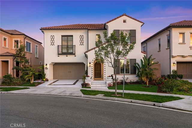 244 Coal Mine, Irvine, CA 92602 - mediterranean / spanish-style home with a balcony, a tiled roof, a garage, and stucco siding