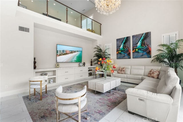 244 Coal Mine, Irvine, CA 92602 - living area featuring a high ceiling, a chandelier, light marble finish flooring, and baseboards