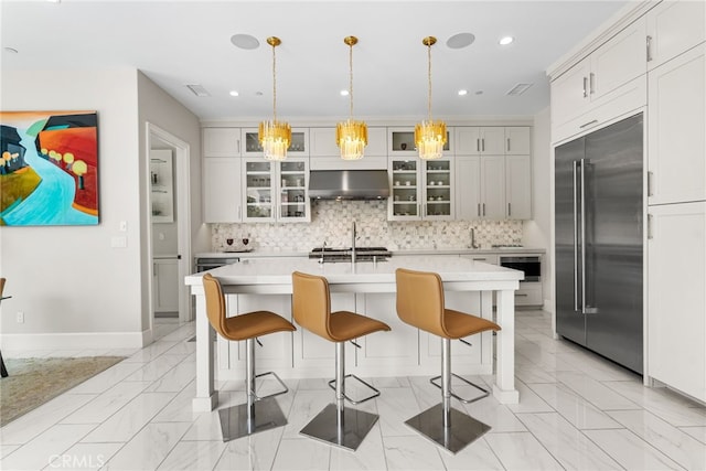 244 Coal Mine, Irvine, CA 92602 - kitchen featuring stainless steel built in fridge, range hood, light countertops, decorative backsplash, and recessed lighting