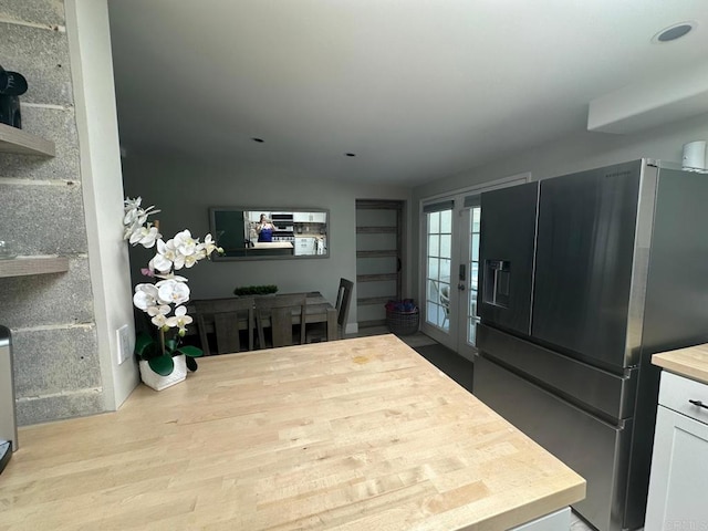 dining room featuring french doors, wood finished floors, and recessed lighting