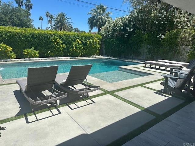 view of pool featuring a patio and a fenced backyard