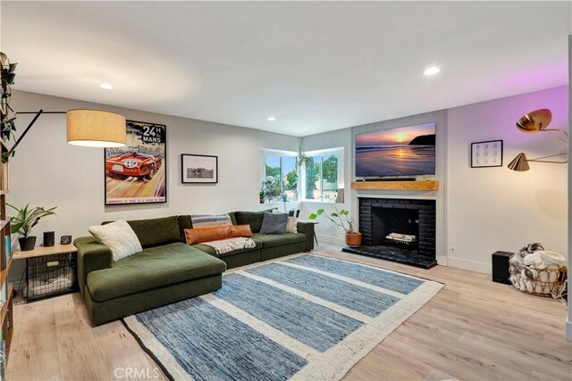 2447 Young Ave, Thousand Oaks, CA 91360 - living area featuring wood finished floors, a fireplace, baseboards, and recessed lighting