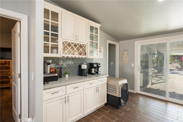 840 S Oak Glen Ave, Nipomo, CA 93444 - indoor dry bar featuring vaulted ceiling, decorative backsplash, dark wood-type flooring, and baseboards