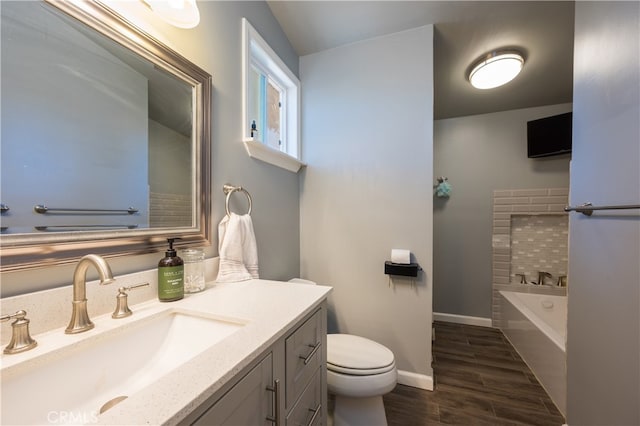 840 S Oak Glen Ave, Nipomo, CA 93444 - full bathroom featuring toilet, a bath, vanity, wood finished floors, and baseboards