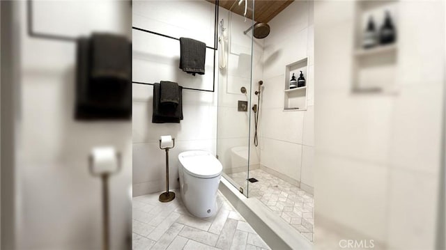 full bath featuring toilet and a stall shower