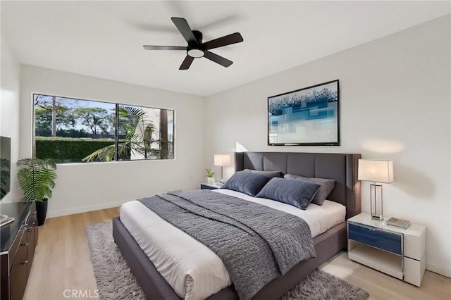 383 N Melrose Dr Unit G, Vista, CA 92083 - bedroom featuring light wood finished floors, a ceiling fan, and baseboards