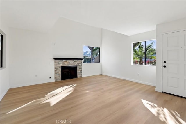 383 N Melrose Dr Unit G, Vista, CA 92083 - unfurnished living room featuring wood finished floors, baseboards, and a fireplace