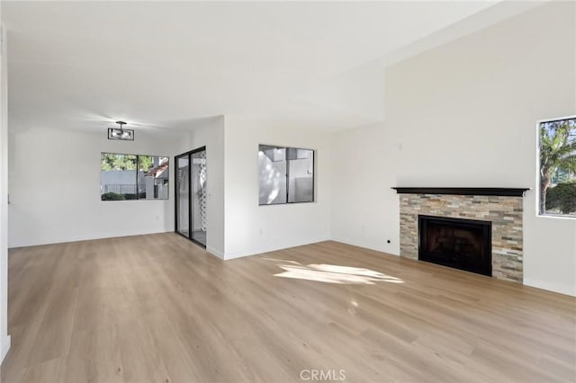 383 N Melrose Dr Unit G, Vista, CA 92083 - unfurnished living room with wood finished floors and a fireplace