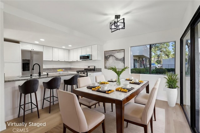 383 N Melrose Dr Unit G, Vista, CA 92083 - dining room with light wood-style floors and recessed lighting
