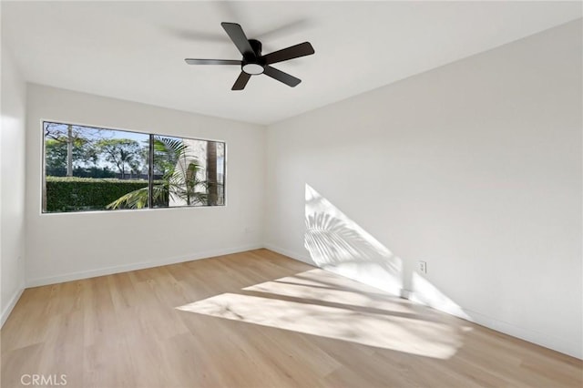 383 N Melrose Dr Unit G, Vista, CA 92083 - empty room featuring wood finished floors, a ceiling fan, and baseboards