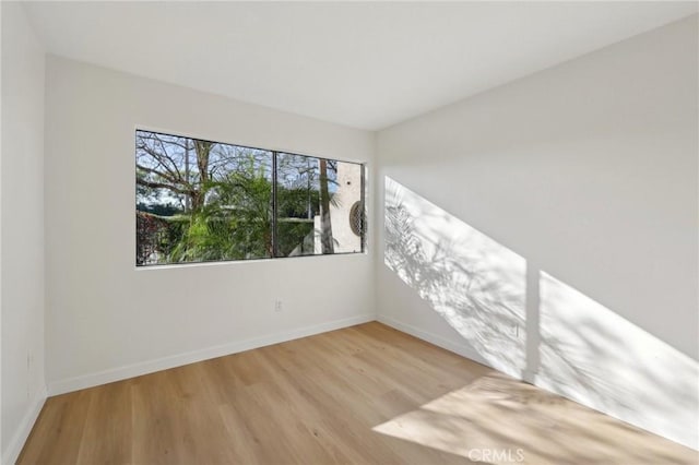 383 N Melrose Dr Unit G, Vista, CA 92083 - empty room with wood finished floors and baseboards