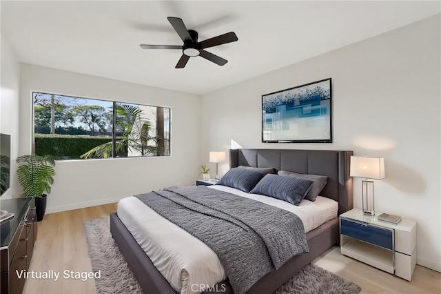 383 N Melrose Dr Unit G, Vista, CA 92083 - bedroom with light wood-style flooring, ceiling fan, and baseboards