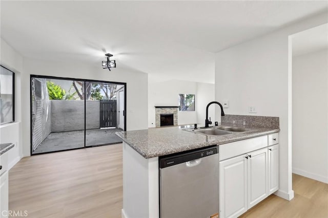 383 N Melrose Dr Unit G, Vista, CA 92083 - kitchen with dishwasher, a sink, light wood-type flooring, a peninsula, and white cabinetry