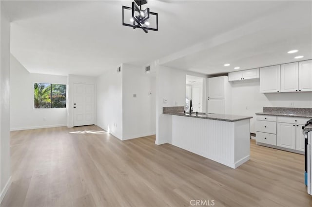 383 N Melrose Dr Unit G, Vista, CA 92083 - kitchen with light wood-style floors, white cabinetry, baseboards, a sink, and recessed lighting