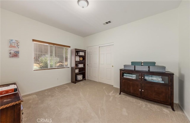 misc room with carpet floors and baseboards