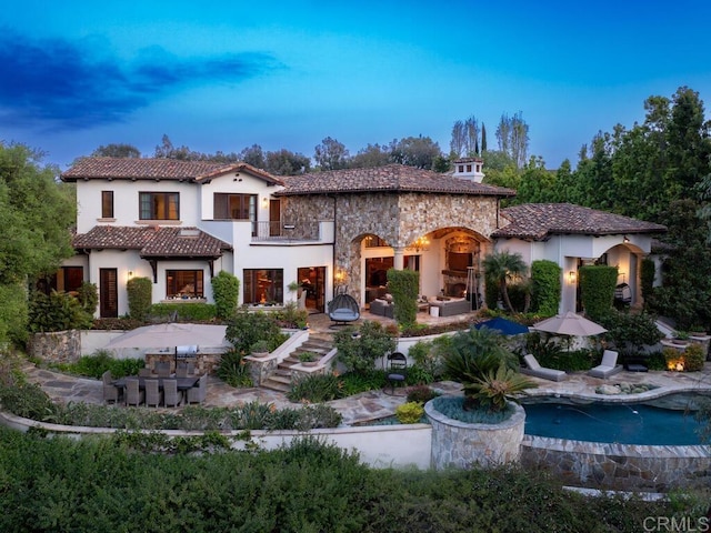 18414 Calle La Serra, Rancho Santa Fe, CA 92091 - rear view of property featuring a balcony, a patio, stucco siding, and stone siding