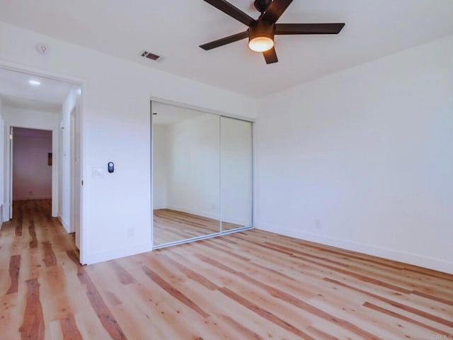 1025 Plover Way, Oceanside, CA 92057 - unfurnished bedroom featuring light wood-type flooring, a closet, baseboards, and a ceiling fan