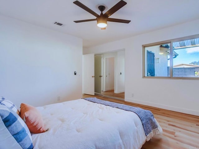1025 Plover Way, Oceanside, CA 92057 - bedroom with wood finished floors, baseboards, and ceiling fan