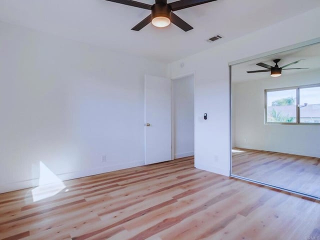 1025 Plover Way, Oceanside, CA 92057 - unfurnished bedroom with wood finished floors, a ceiling fan, and a closet