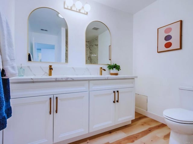 1025 Plover Way, Oceanside, CA 92057 - full bathroom with toilet, wood finished floors, double vanity, and baseboards