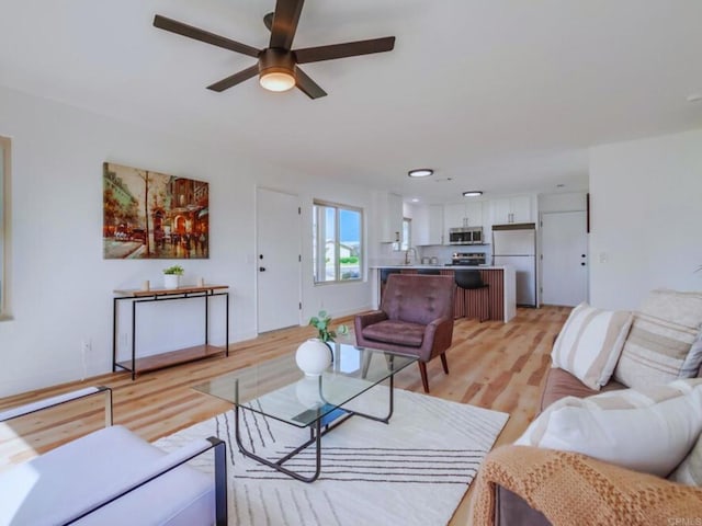 1025 Plover Way, Oceanside, CA 92057 - living room with light wood-type flooring and ceiling fan