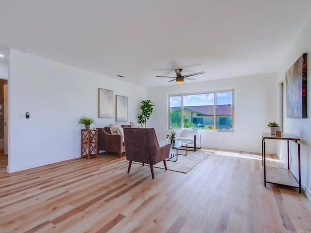 1025 Plover Way, Oceanside, CA 92057 - living area with light wood finished floors, ceiling fan, and baseboards