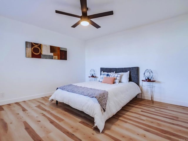 1025 Plover Way, Oceanside, CA 92057 - bedroom with wood finished floors, baseboards, and a ceiling fan