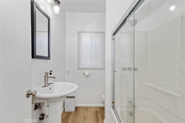 1305 Cosmic Way, Glendale, CA 91201 - full bathroom with wood finished floors, baseboards, toilet, and enclosed tub / shower combo