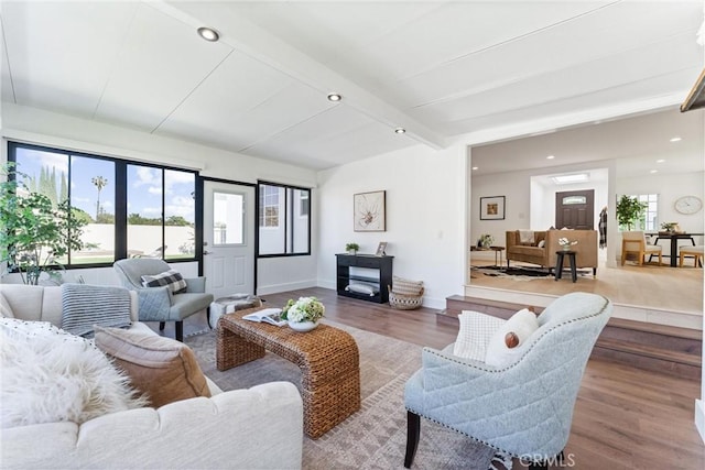 18011 Theodora Dr, Tustin, CA 92780 - living area featuring wood finished floors, beamed ceiling, recessed lighting, and baseboards