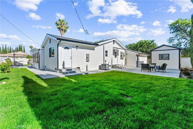 18011 Theodora Dr, Tustin, CA 92780 - back of property featuring central air condition unit, a patio, a yard, an outdoor living space, and stucco siding