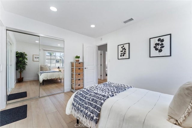18011 Theodora Dr, Tustin, CA 92780 - bedroom featuring light wood finished floors, a closet, and recessed lighting