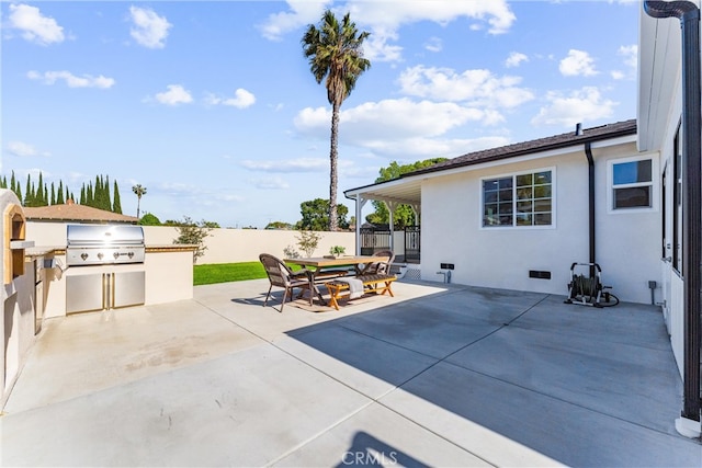 18011 Theodora Dr, Tustin, CA 92780 - view of patio with exterior kitchen, fence, area for grilling, and outdoor dining space