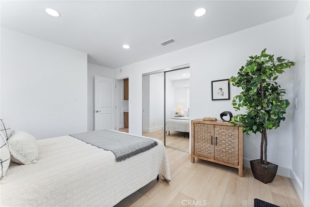 18011 Theodora Dr, Tustin, CA 92780 - bedroom with light wood-type flooring, a closet, baseboards, and recessed lighting