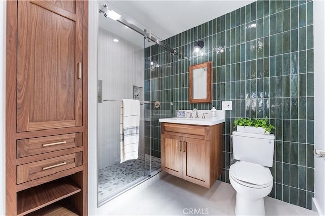 18011 Theodora Dr, Tustin, CA 92780 - full bath with tile walls, tiled shower, vanity, toilet, and tile patterned floors