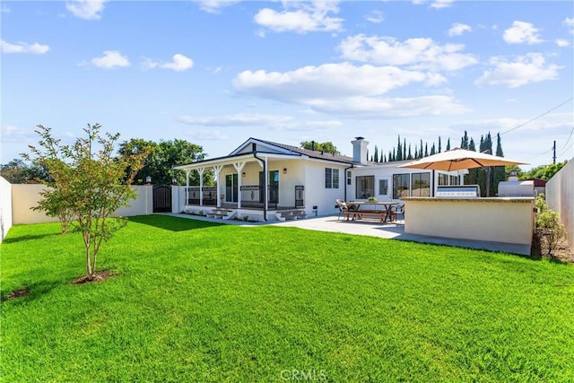 18011 Theodora Dr, Tustin, CA 92780 - back of house with stucco siding and a patio
