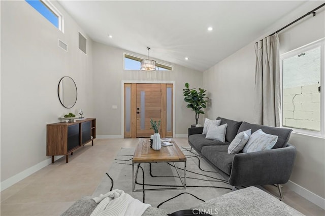 living room with vaulted ceiling, plenty of natural light, a chandelier, recessed lighting, and baseboards