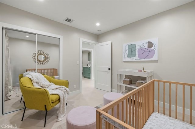 bedroom with recessed lighting, a closet, and carpet floors