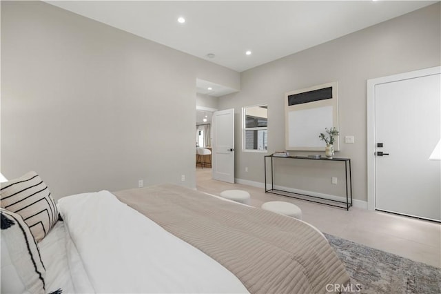 bedroom featuring recessed lighting, baseboards, and connected bathroom