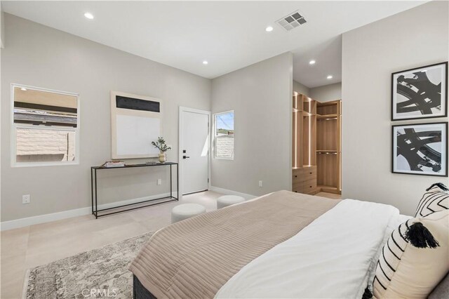 bedroom featuring recessed lighting and baseboards