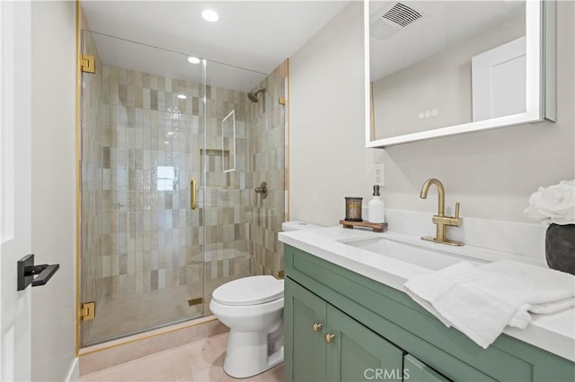 full bath featuring toilet, a stall shower, recessed lighting, vanity, and tile patterned flooring