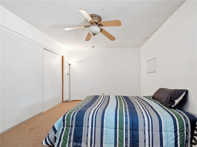 17949 Catalpa St, Hesperia, CA 92345 - bedroom featuring carpet, a textured ceiling, ceiling fan, and a closet