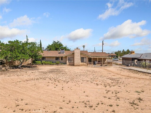 17949 Catalpa St, Hesperia, CA 92345 - rear view of property featuring a chimney