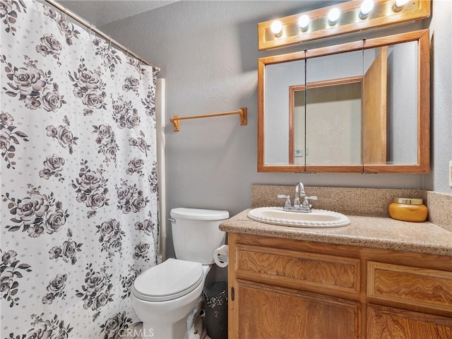17949 Catalpa St, Hesperia, CA 92345 - bathroom with vanity, toilet, and a shower with shower curtain