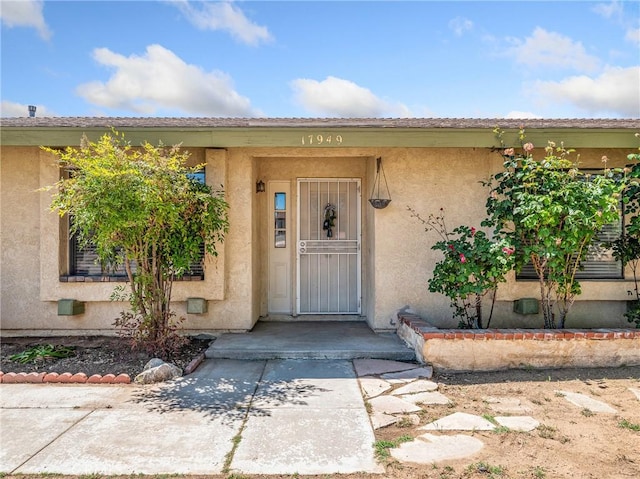 17949 Catalpa St, Hesperia, CA 92345 - doorway to property featuring stucco siding