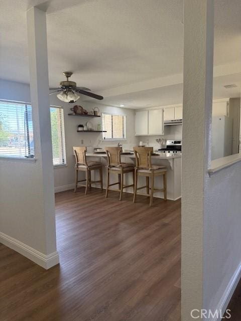 17949 Catalpa St, Hesperia, CA 92345 - dining room with dark wood-style flooring and a ceiling fan