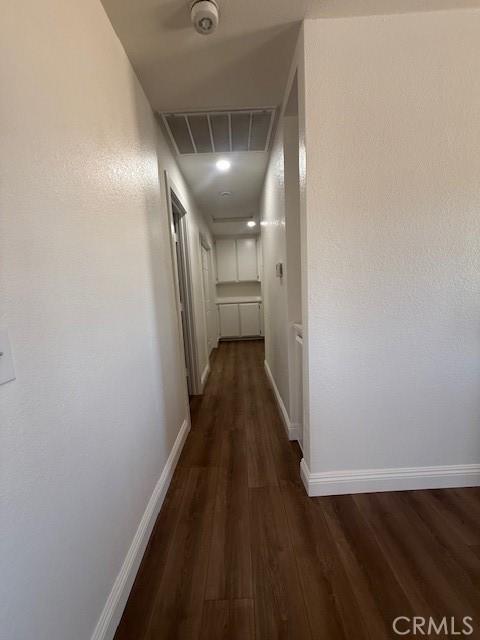 17949 Catalpa St, Hesperia, CA 92345 - hallway with dark wood-type flooring and attic access
